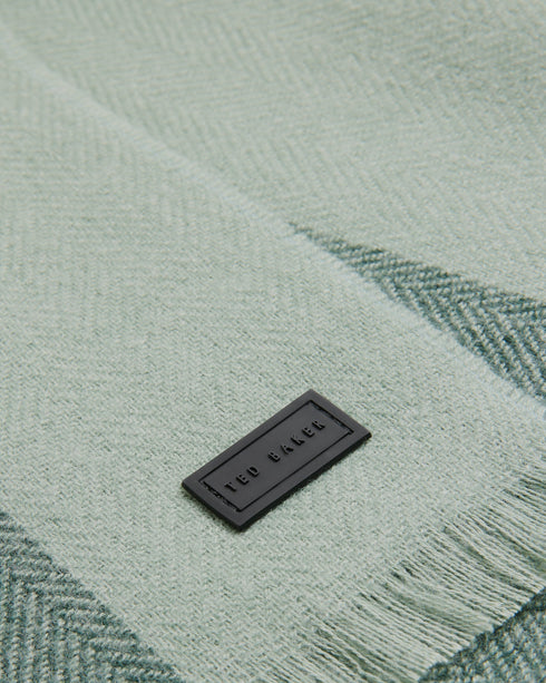 ALFREDY-Scarves-ALFREDY keeps you cosy with ease. This wardrobe staple is ready for action, whether you're jetting off for a weekend away or heading to the office. A striped design means its sure to look cool whatever the weather, and its woven knit is perfect for whipping round your shoulders when the wind picks up.The fabric of this product is made with 65% recycled polyester. Using recycled polyester helps divert plastic waste from ending in landfills. Scarf Woven knit Striped Fringed edge Ted Baker bran